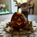 A gourd light centerpiece with a wavy rim. A candle lights the carved mandala design that shows the candle light through.